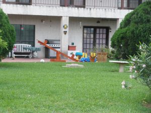 kids seesaw in backyard